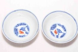 Pair Chinese bowls with iron red bats and blue swirls, 12cm diameter, six character mark.