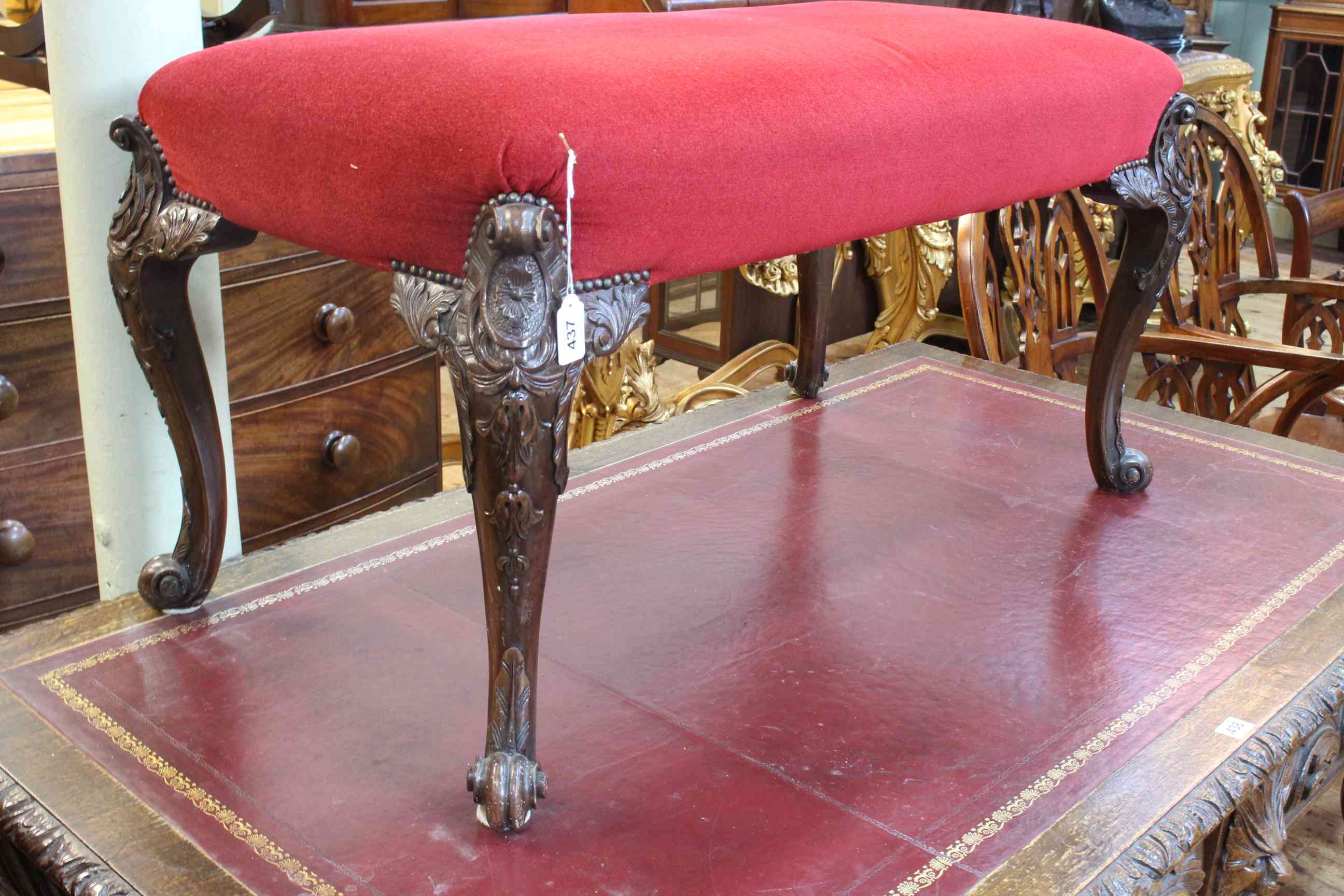 Large 19th Century stool on ornately carved cabriole legs, 52cm by 97cm by 52cm.