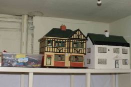 Two dolls houses including Tudor style and box of model vehicles.