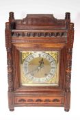 Victorian walnut mantel clock with brass dial, 40cm high.