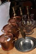 Three copper and brass twin handled pans, set of four graduated saucepans,