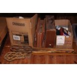 Bag of vintage golf clubs, two carpets beaters, two rulers, tennis racket, leather suitcase,