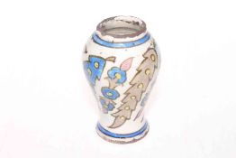 Antique Iznik pottery vase with stylised leaf decoration, 13cm.