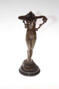 Bronze semi-clad lady in a dancing pose on plinth stand, 37cm.