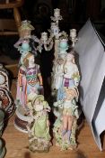 Two pairs and single bisque figures, pair of Continental porcelain woman and cherub candle holders,