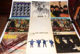 Collection of fourteen Beatles LP's, and four others.