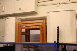 Two Lloyd Loom linen bins and nest of three tables (3).