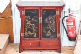 Oriental style black lacquer and gilt painted panel door altar cabinet, 93cm by 82cm by 38cm.