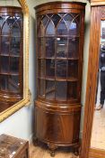 Mahogany bow front glazed panel door top standing corner cabinet, 201cm.