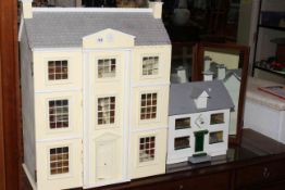 Two dolls houses.