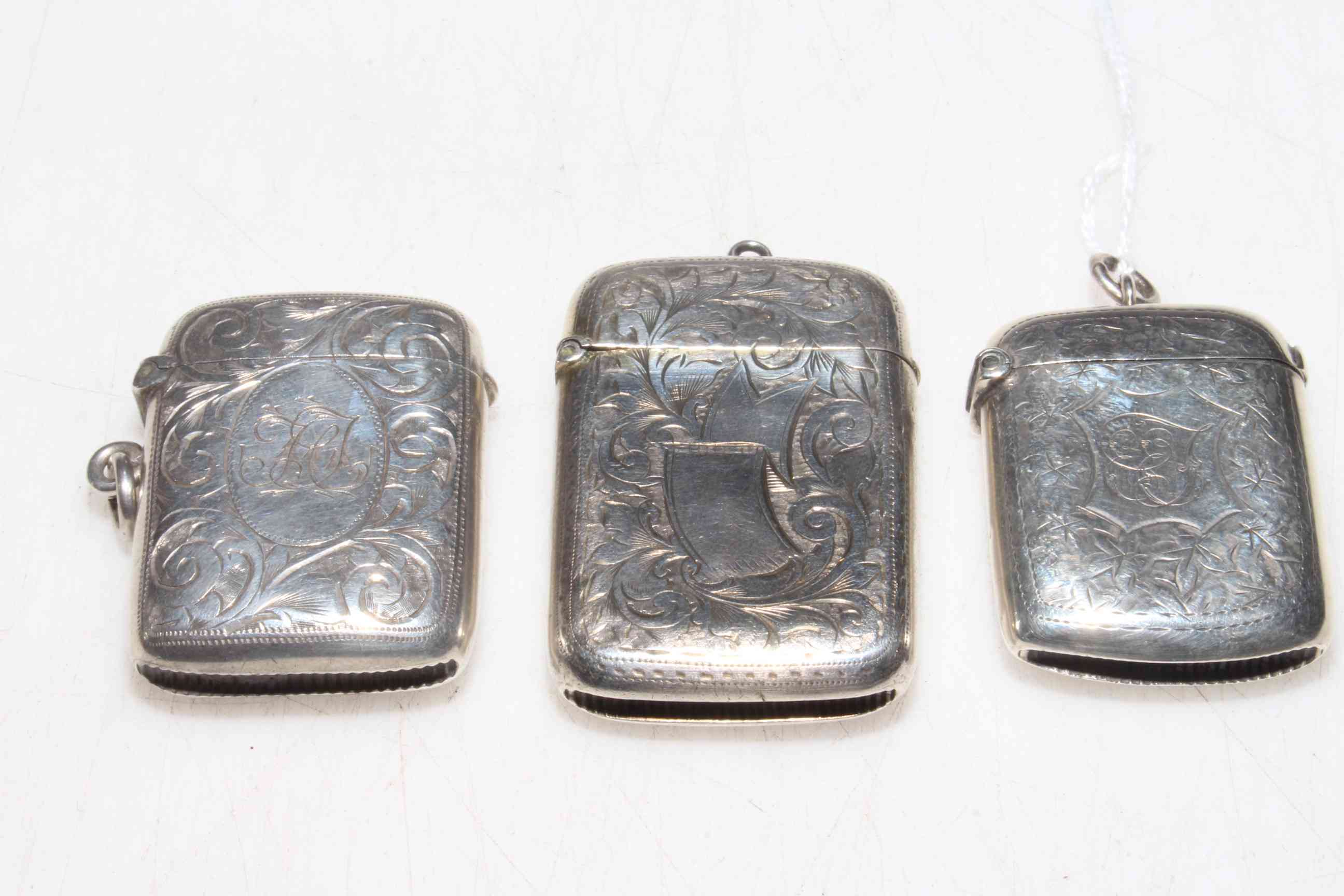 Three silver vesta cases, Birmingham 1890, 1901 and Chester 1903.