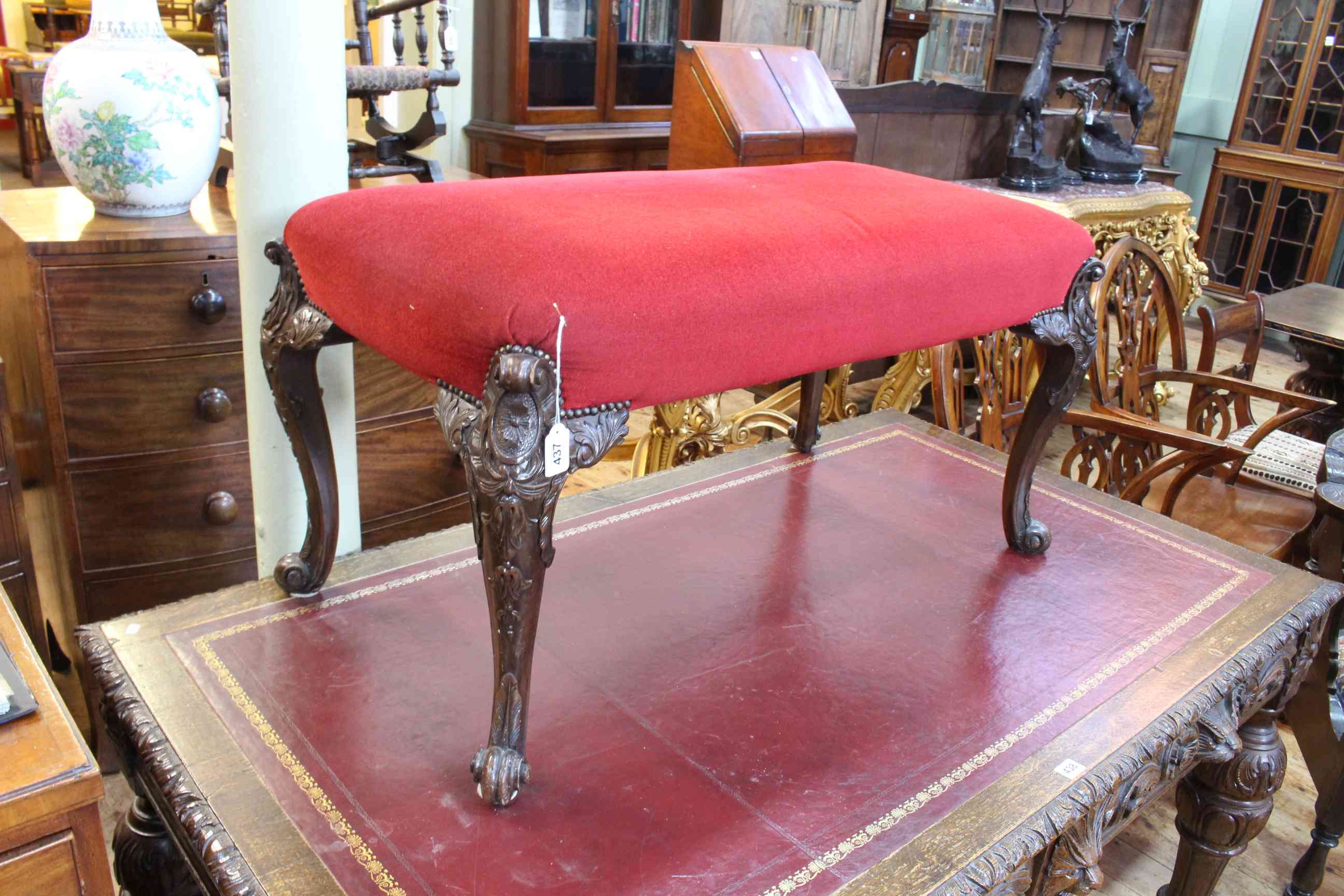 Large 19th Century stool on ornately carved cabriole legs, 52cm by 97cm by 52cm. - Image 2 of 2