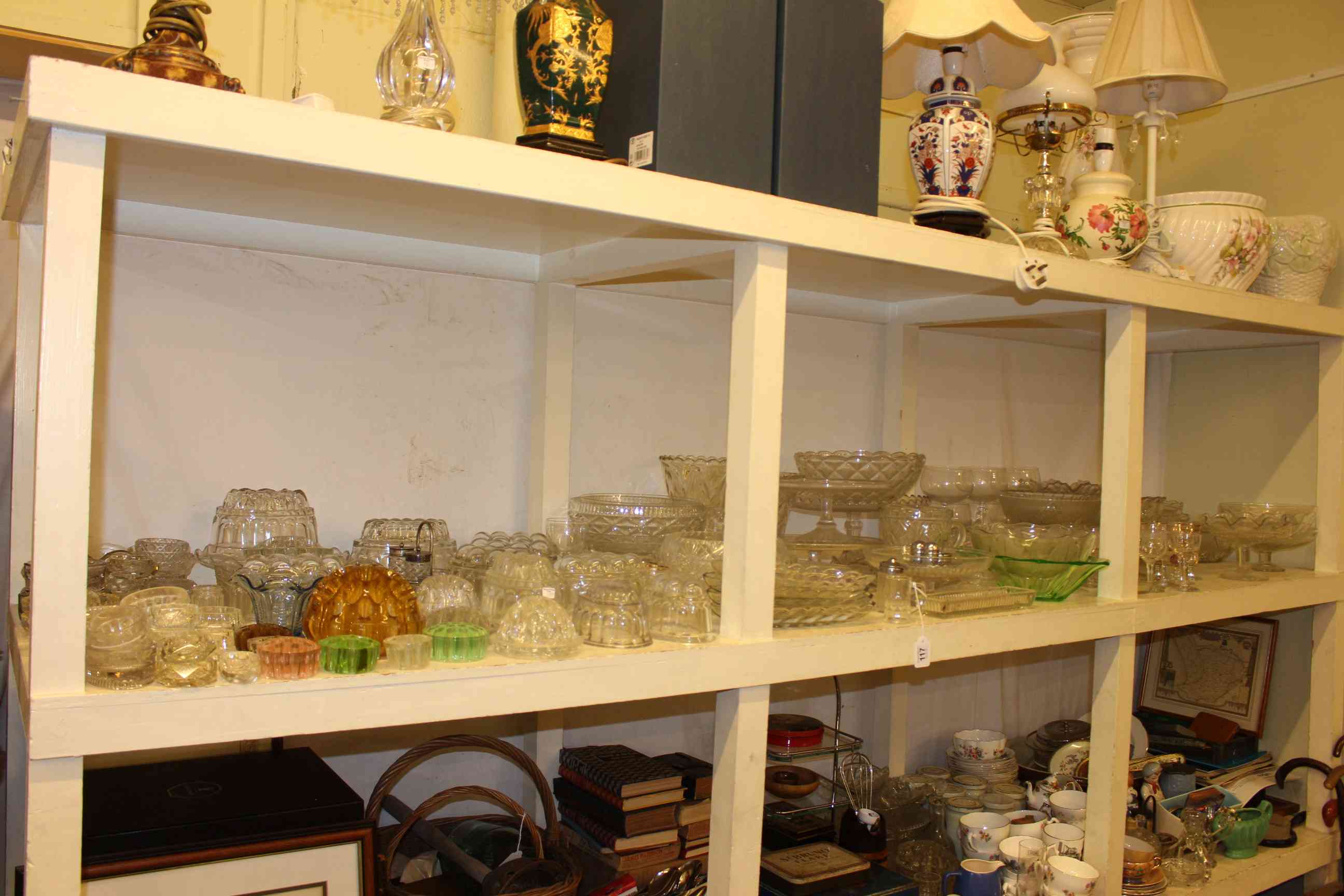 Large collection of glassware including jelly moulds, vases, bowls, comports, etc.