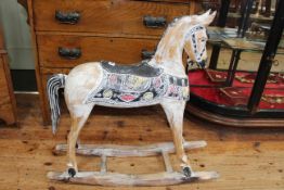 Decorative wooden rocking horse, 78cm long by 77cm high.