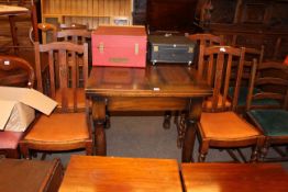 Oak dual purpose table and set of four oak dining chairs.