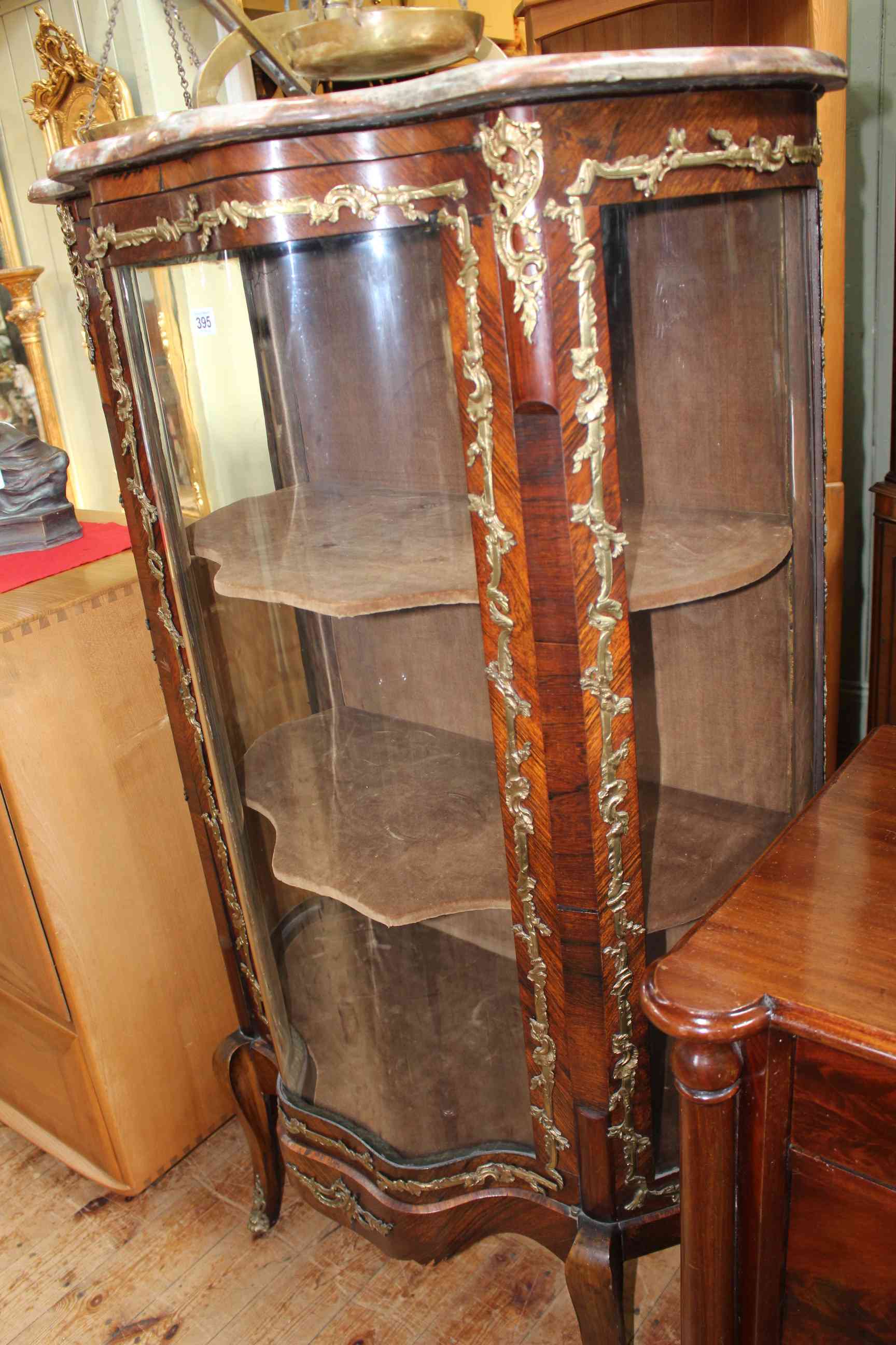 Continental rosewood, marble topped and gilt metal mounted serpentine front vitrine,