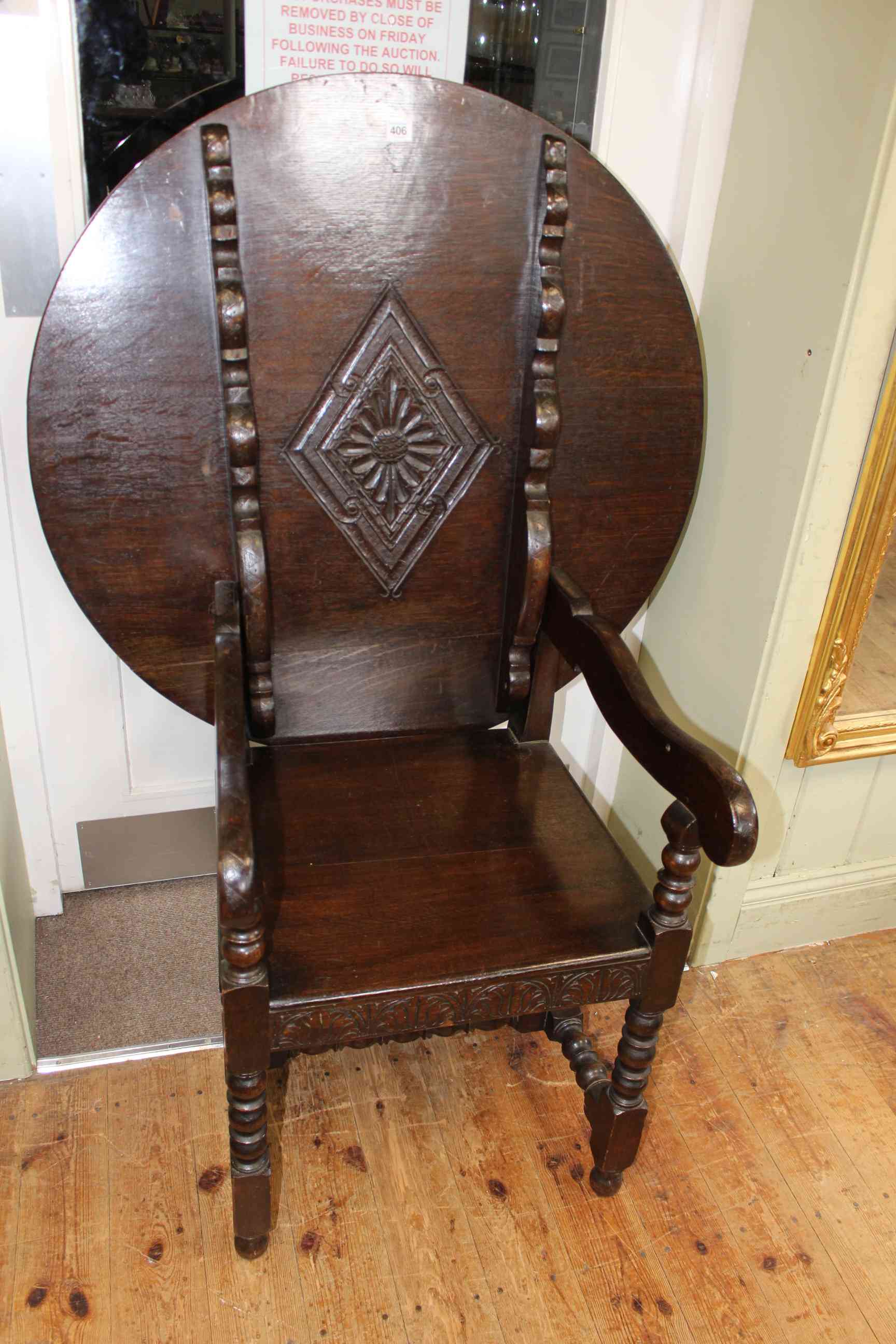 Carved oak circular topped monks seat, 74cm by 91cm top down.