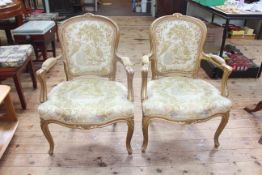 Pair French style gilt painted fauteuils in tapestry fabric.