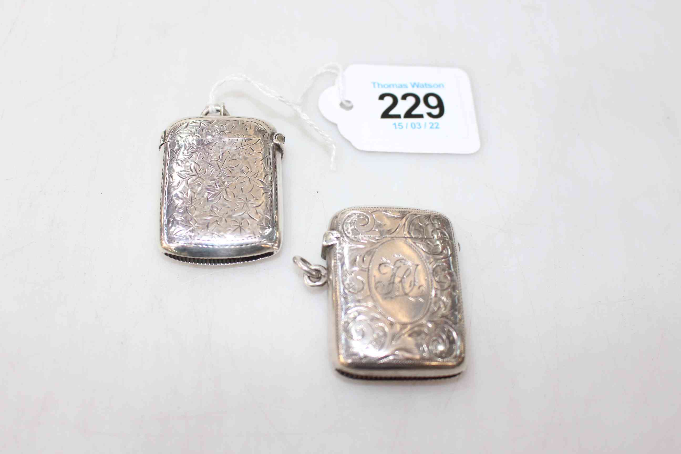 Two engraved silver vesta cases.