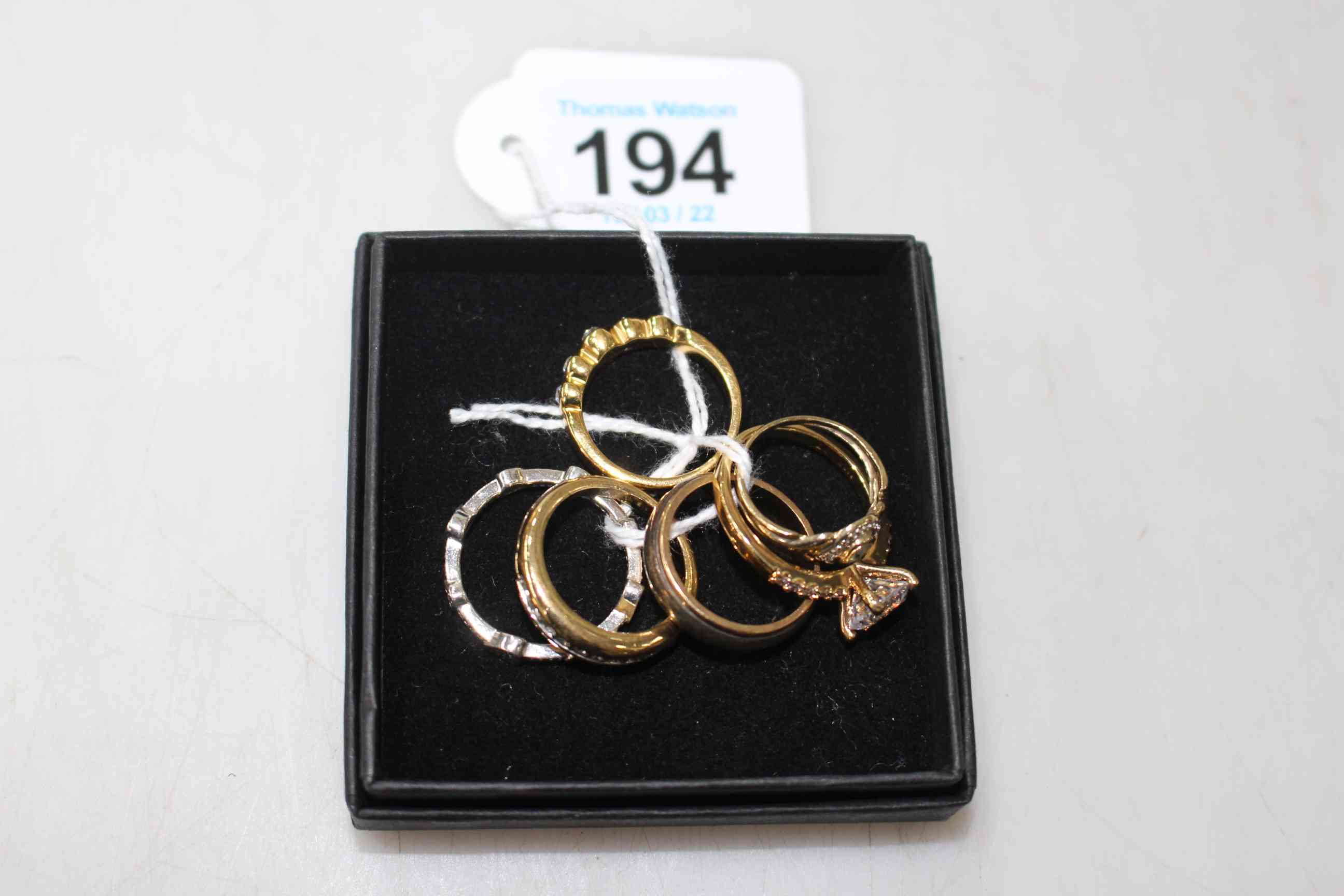 Collection of six rings and Ice Tag.