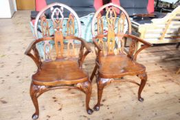 Pair Gothic style Windsor elbow chairs with crinoline stretchers.