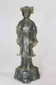 Chinese carved green hardstone figure of a lady, 18cm.