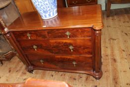 Late Victorian mahogany chest of two short above two long drawers with rounded corners and turned