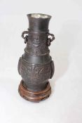 Chinese bronze Hu vase with wood stand, 14cm overall.