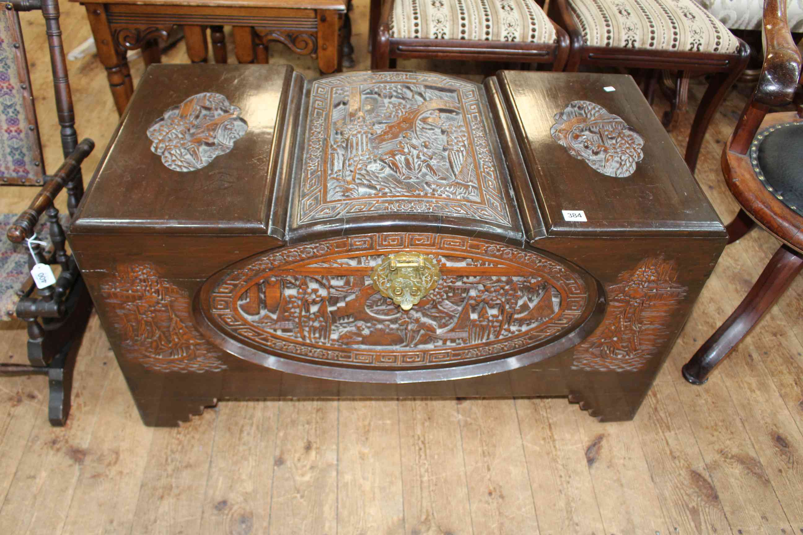 Oriental carved camphorwood trunk, 50cm by 93cm by 46cm.