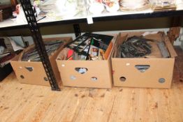 Three boxes of train accessories, tracks, locomotives, etc.