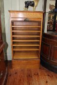 Early 20th Century oak tambour front filing cabinet, 99cm by 53cm by 29.5cm.