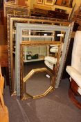 Four various framed wall mirrors.