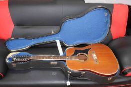 Twelve string guitar and case.