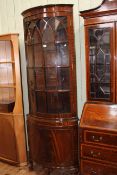 Mahogany bow front glazed panel door top standing corner cabinet, 201cm.