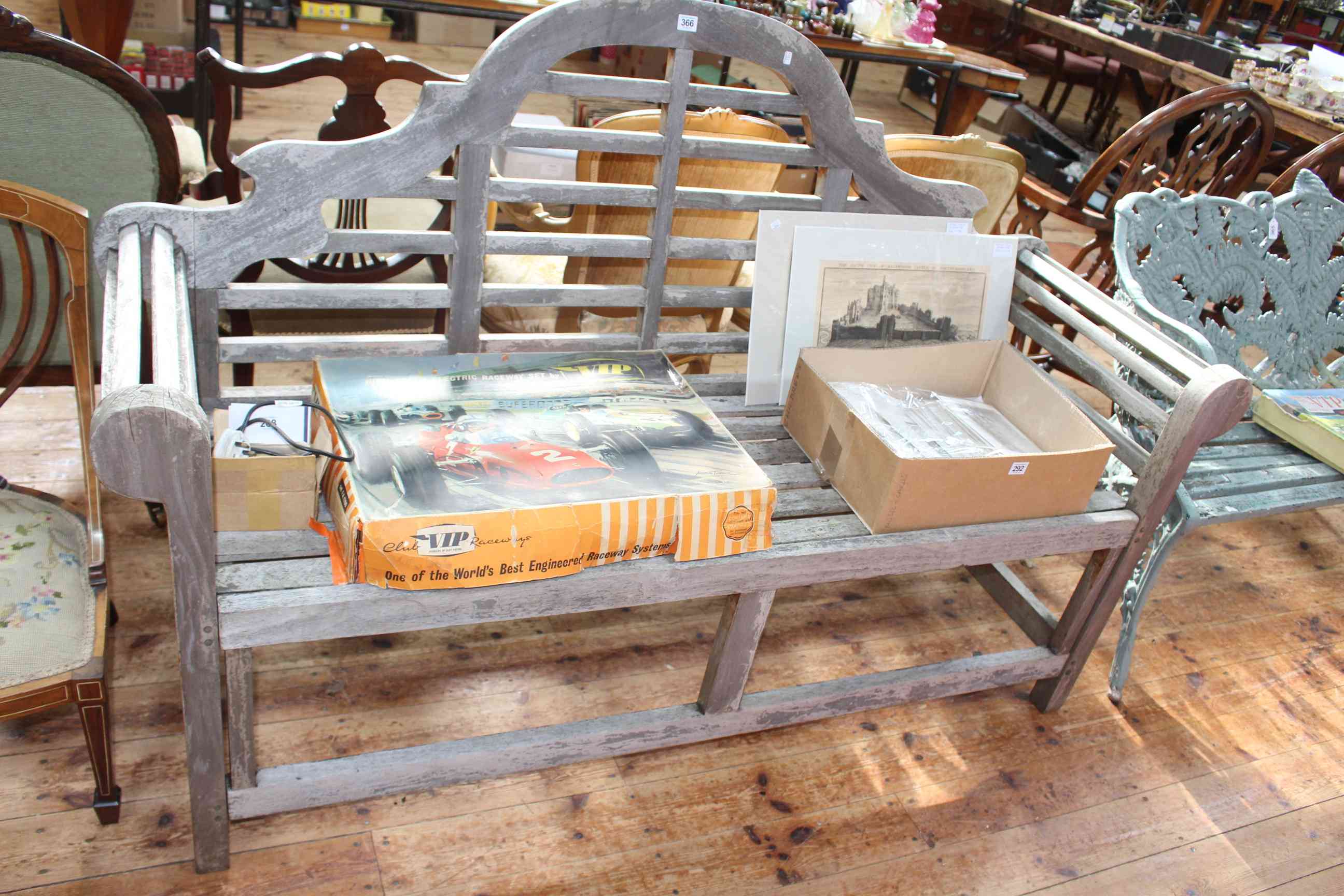 Teak arched back garden bench, 104.5cm by 163cm.