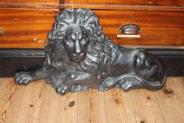 Cast metal lion doorstop, 70cm length.