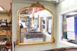 Gilt framed overmantel mirror with shell and floral crest, 147cm by 144cm.