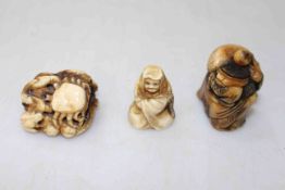 Three Japanese Meiji period ivory netsuke, one with crab and frogs signed.