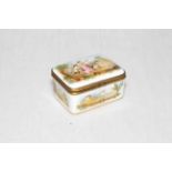Good antique porcelain box painted with putti and landscapes, gilt monogram to base, 8cm across.