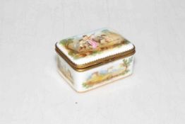 Good antique porcelain box painted with putti and landscapes, gilt monogram to base, 8cm across.