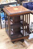 Inlaid mahogany two tier revolving bookcase, 82cm by 47cm by 47cm.