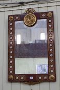 Continental rectangular bevelled wall mirror, the frame decorated with brass and porcelain roundels,