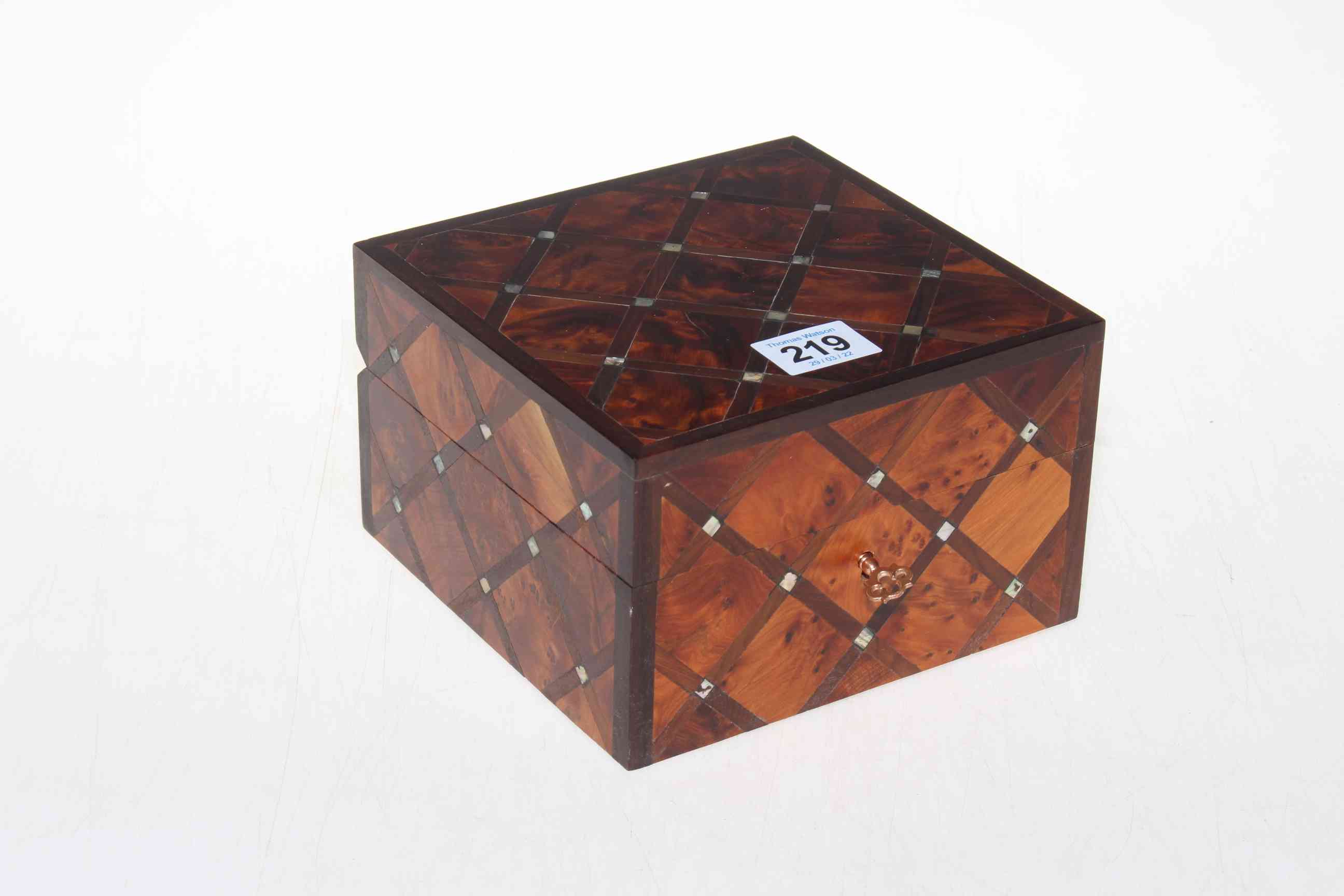 Mixed wood and mother of pearl box (unopened).