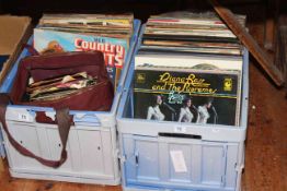 Two boxes of vinyls and singles.