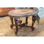 Oval carved rosewood Indian elephant table, 75cm by 93cm by 60cm.