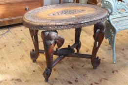 Oval carved rosewood Indian elephant table, 75cm by 93cm by 60cm.