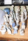 Eighteen Nao figurines, Troika Stives teapot, silver cased spoons.