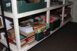 Full shelf of vintage games, football programmes, books, etc.