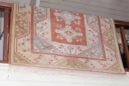 Wool Geometrical and floral design rug 2.30 by 1.55.