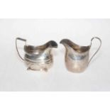 Two George III silver cream jugs and Georgian pistol grip knife and fork.